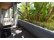 Patio with a privacy fence, lush tropical landscaping, and outdoor seating at 10265 Gandy N Blvd # 1409, St Petersburg, FL 33702