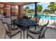 Covered patio with a dining table overlooking the community pool area at 10265 Gandy N Blvd # 1409, St Petersburg, FL 33702