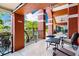 Covered patio with ceiling fans and outdoor seating with views of the tropical landscape at 10265 Gandy N Blvd # 1409, St Petersburg, FL 33702