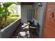 View of the unit's porch with two chairs and foliage view at 10265 Gandy N Blvd # 1409, St Petersburg, FL 33702
