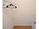 Walk-in closet with wood-look tile flooring, white wire shelving, and white door at 10265 Gandy N Blvd # 1409, St Petersburg, FL 33702