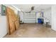 Large garage featuring concrete floors and a utility sink at 10336 Alice M Ct, Port Richey, FL 34668