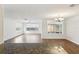 Spacious living room with wood floors, bright windows, and recessed lighting at 10336 Alice M Ct, Port Richey, FL 34668