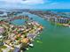 Expansive aerial vista of waterfront community featuring homes, docks, and glistening turquoise waterways at 1135 81St S St, St Petersburg, FL 33707