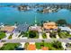 Beautiful aerial view showcases waterfront homes with docks, pools, and lush landscaping by the water at 1135 81St S St, St Petersburg, FL 33707