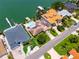 Stunning aerial view showcases waterfront homes with docks, lush landscaping, and sparkling pools at 1135 81St S St, St Petersburg, FL 33707