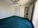 Simple bedroom with standard closet, window, neutral walls and ceiling fan at 1135 81St S St, St Petersburg, FL 33707