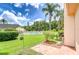 Spacious backyard patio with mature landscaping, lawn, and a tranquil pool view at 11511 113Th St # 33D, Largo, FL 33778