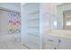 Bathroom features a shower-tub combination, vanity with ample counter space, and built-in linen shelves at 11511 113Th St # 33D, Largo, FL 33778