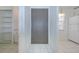 Hallway with a large gray closet door, tile flooring, and access to the kitchen at 11511 113Th St # 33D, Largo, FL 33778