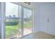 Sliding doors lead to a screened lanai with views of the community pool and well-maintained landscaping at 11511 113Th St # 33D, Largo, FL 33778