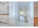 Hallway view of the living room featuring wood-look floors and a ceiling fan at 11511 113Th St # 33D, Largo, FL 33778