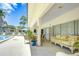 Charming outdoor patio with comfortable seating, providing a serene relaxation space by the pool at 11511 113Th St # 33D, Largo, FL 33778