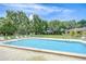Inviting community pool surrounded by lush greenery, providing a serene and relaxing environment at 11511 113Th St # 33D, Largo, FL 33778