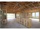 Framing of large open living space showing the ceiling and window placements at 11858 Richmond Trl, Parrish, FL 34219