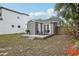 Backyard featuring a deck with outdoor seating and lush green surroundings, perfect for relaxation at 120 W Sligh Ave, Tampa, FL 33604