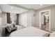 Spacious bedroom with access to the backyard, closet, and an adjacent doorway to the kitchen at 120 W Sligh Ave, Tampa, FL 33604