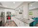 Modern kitchen with stainless steel appliances and granite countertops, perfect for entertaining at 120 W Sligh Ave, Tampa, FL 33604