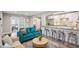 Spacious living area featuring bar seating, opening into the kitchen and bedrooms at 120 W Sligh Ave, Tampa, FL 33604