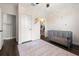 Cute Bedroom with dark wood floors, closet, ceiling fan, and decorated with flower decals at 12415 Hitching St, Odessa, FL 33556