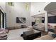 Large living area with tall ceilings and modern entertainment setup at 12415 Hitching St, Odessa, FL 33556