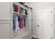 Organized mudroom featuring built-in shelving, coat hooks, and bench seating for convenience at 12415 Hitching St, Odessa, FL 33556