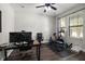 Dedicated office space featuring dual-monitor workstation and fitness equipment at 12415 Hitching St, Odessa, FL 33556
