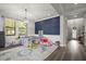 Bright playroom with a blue accent wall and elegant lighting at 12415 Hitching St, Odessa, FL 33556