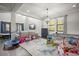 Large playroom featuring high ceilings, modern furnishings and a variety of toys and play equipment at 12415 Hitching St, Odessa, FL 33556