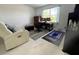 Bright bedroom featuring a desk, a comfortable recliner, and natural light from a window at 1247 Gentilly Ln, Wesley Chapel, FL 33544