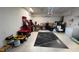 Spacious two-car garage featuring ample storage space and a black carpet at 1247 Gentilly Ln, Wesley Chapel, FL 33544