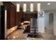 Well-lit kitchen features granite countertops, stainless steel appliances, and updated cabinetry at 1247 Gentilly Ln, Wesley Chapel, FL 33544