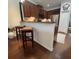 Kitchen with counter seating offers a convenient spot for casual dining and gatherings at 1247 Gentilly Ln, Wesley Chapel, FL 33544
