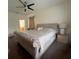 Large main bedroom with dark wood floors and a neutral color palette at 1247 Gentilly Ln, Wesley Chapel, FL 33544