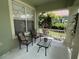 Inviting covered porch with comfortable seating, perfect for relaxing outdoors at 1247 Gentilly Ln, Wesley Chapel, FL 33544