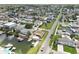 Aerial view of waterfront homes along canals, providing direct access to open water at 13727 Gene Rossi Ave, Hudson, FL 34667