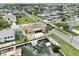 Exterior aerial view of a canal-front house featuring a private boat dock and boat lift system with easy access to waterways at 13727 Gene Rossi Ave, Hudson, FL 34667