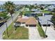 Aerial view of a charming home with a spacious front yard, nestled in a friendly community at 13727 Gene Rossi Ave, Hudson, FL 34667