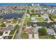 Aerial view of a waterfront neighborhood with canal access and scenic ocean views at 13727 Gene Rossi Ave, Hudson, FL 34667