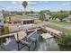 Waterfront home features a boat lift and an extended dock with convenient access to local waterways and nearby canals at 13727 Gene Rossi Ave, Hudson, FL 34667