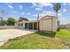 Large backyard features a screened lanai, a storage shed, and a concrete patio at 13727 Gene Rossi Ave, Hudson, FL 34667