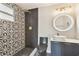 Modern bathroom with stylish tiling, contemporary fixtures, and a glass-enclosed shower at 13727 Gene Rossi Ave, Hudson, FL 34667