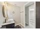 Modern bathroom featuring stylish fixtures and access to bedroom/closet at 13727 Gene Rossi Ave, Hudson, FL 34667