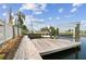 Waterfront property with private dock and boat lift, perfect for boating and enjoying the water at 13727 Gene Rossi Ave, Hudson, FL 34667