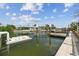This canal-front home has a private dock, providing direct access to waterways and boating opportunities at 13727 Gene Rossi Ave, Hudson, FL 34667