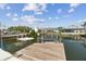 This waterfront home has a private dock with a boat lift for easy access to boating and water activities at 13727 Gene Rossi Ave, Hudson, FL 34667