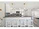 Bright kitchen with stainless appliances, granite counters, breakfast bar and pendant lights at 13727 Gene Rossi Ave, Hudson, FL 34667