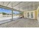 Spacious lanai featuring brick pavers and ample space for entertaining with views of the canal at 13727 Gene Rossi Ave, Hudson, FL 34667