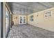 The enclosed lanai has brick pavers, an exit sign, and access to the backyard at 13727 Gene Rossi Ave, Hudson, FL 34667