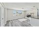 Open-concept living space with fireplace and access to updated kitchen at 13727 Gene Rossi Ave, Hudson, FL 34667